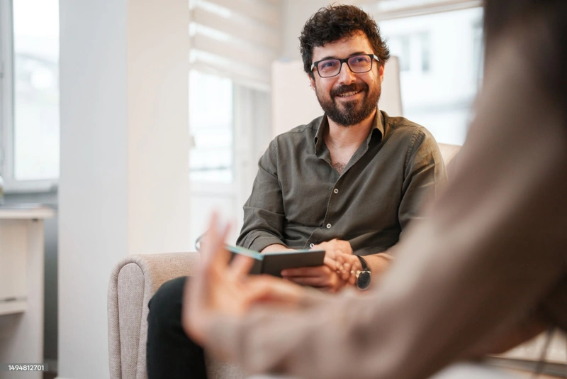 Couch talking with student